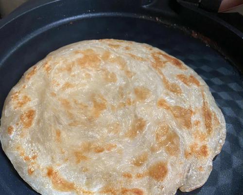 手抓饼饭包的制作方法（轻松学会制作美味手抓饼饭包）